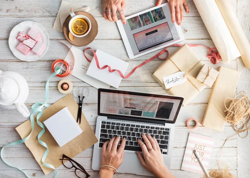 stock photo of women's hands working on laptop an table