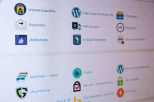 A computer screen displaying website management tools, including WordPress, phpMyAdmin, and Cloud Backup icons with descriptions.