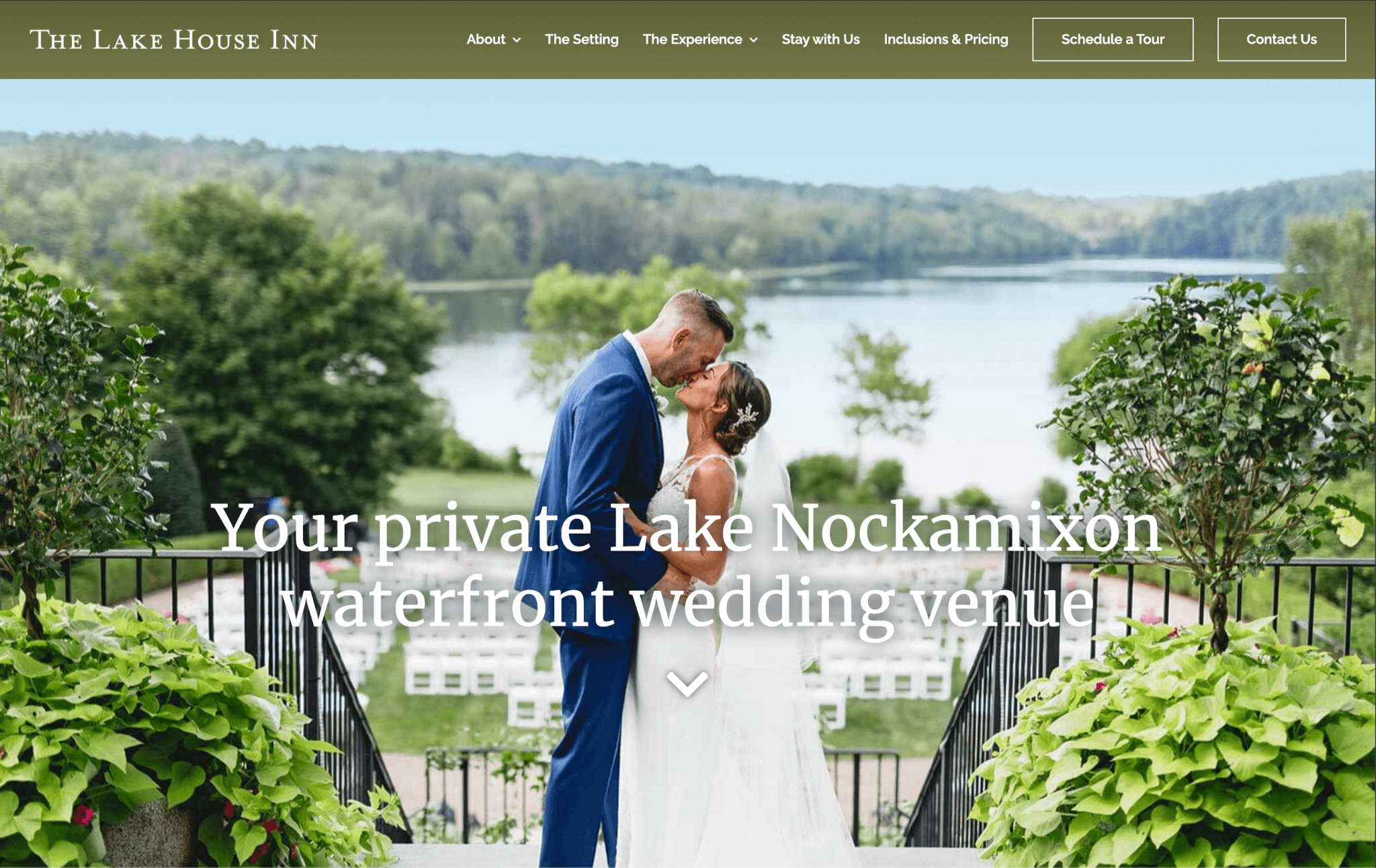 Couple kissing at an outdoor wedding venue overlooking Lake Nockamixon.